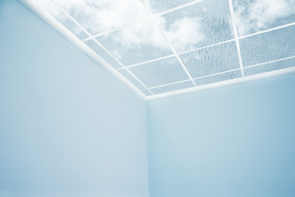 Blue sky and clouds through a window roof